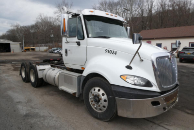 International Prostar+ 122 truck in view showing cab and front tires with number 91024 on door and chrome bumper