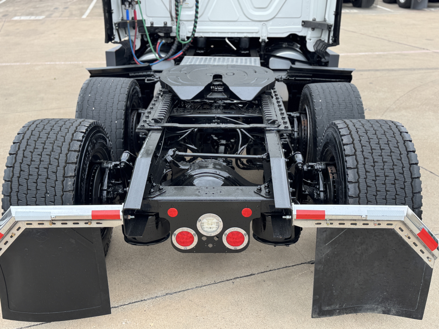 Freightliner PT126064ST chassis rear view showing dual rear axles and fifth wheel mount.