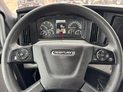 Freightliner steering wheel and dashboard view from the driver's seat in a 2021 Freightliner PT126064ST truck showing instrument cluster and controls.