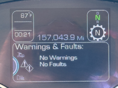 Kenworth T680 cab dashboard showing speedometer, gear N, engine status, 87°F, 00:21, and “Warnings & Faults: No Warnings No Faults.”