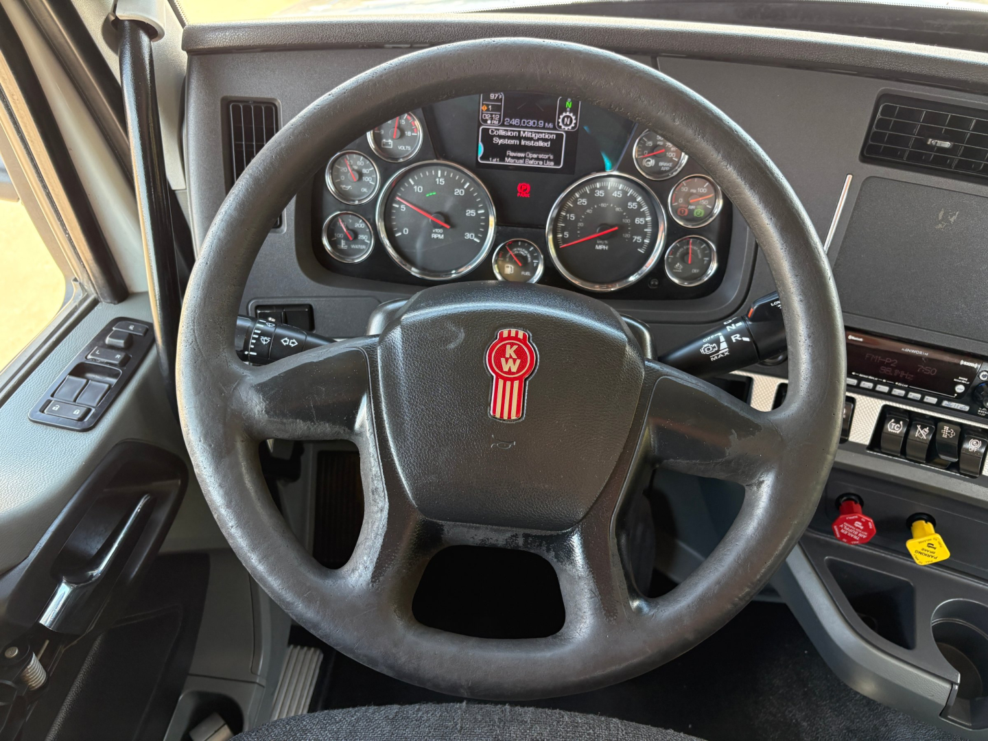 Kenworth T880 dashboard and steering wheel view showing gauges and controls