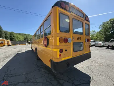 IC Corporation CE Series school bus rear view showing yellow body, back doors, and tail lights.
