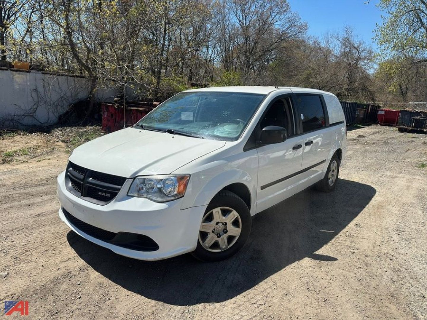 Dodge Ram cargo van in white, front-left view showing the van in an outdoor lot