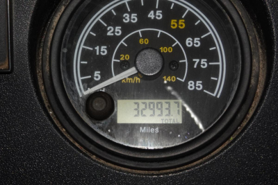 Mack RD RD688S truck dashboard speedometer showing 60 mph increments and total miles 323,? not clear