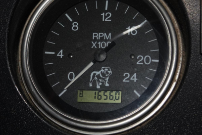 RPM gauge showing 0-20 x100 with dog graphic and digital odometer reading 16560.0 in a Mack RD RD688S dashboard."