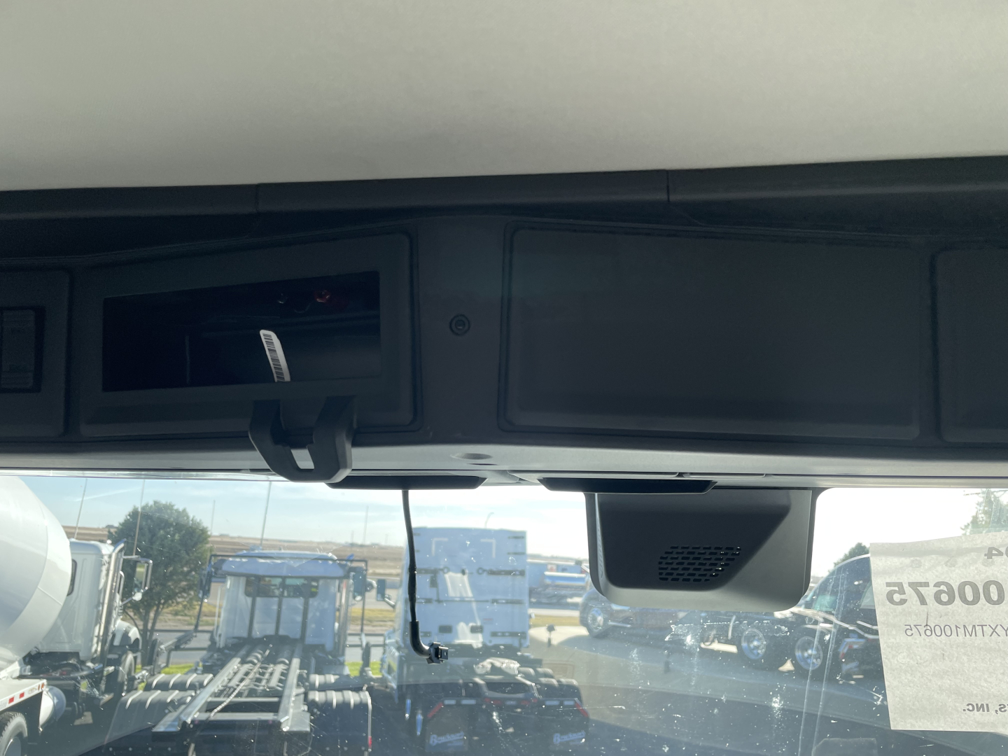 Mack PR64T truck cab interior view showing overhead dash area and vanity mirror.