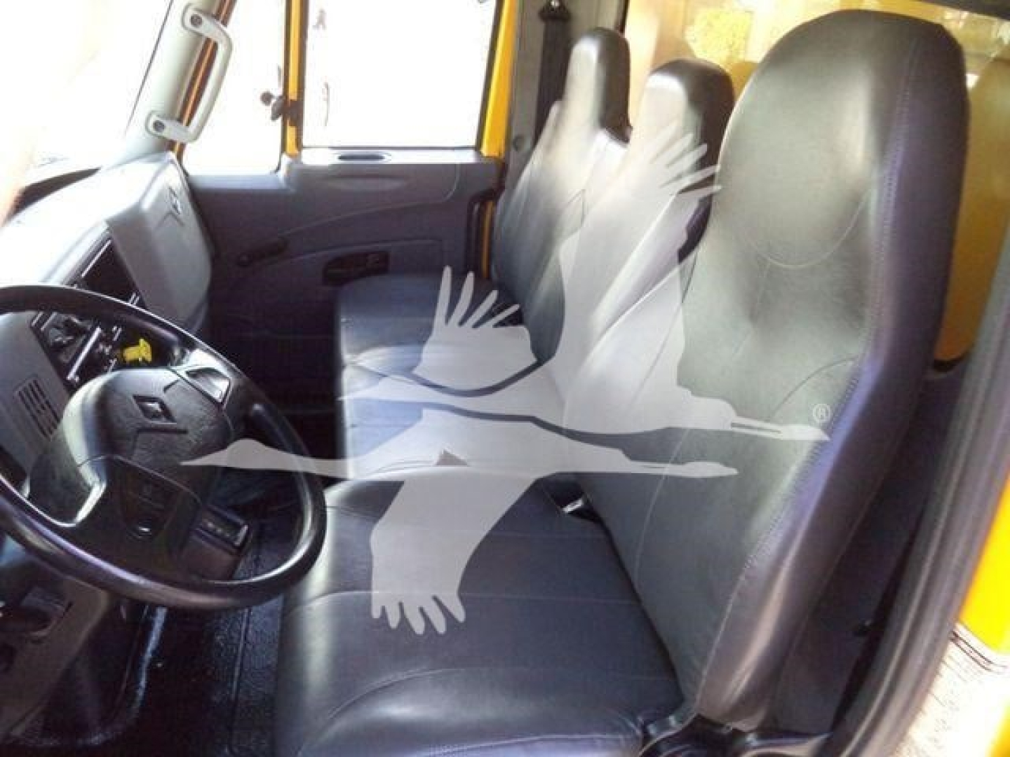 Interior of a 2019 International Durastar cab showing two front seats and steering wheel.