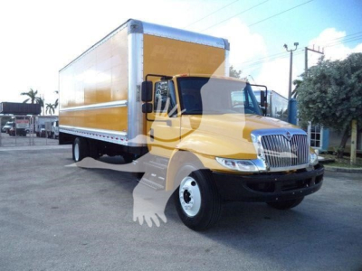 Truck engine bay and cargo box of a yellow 2019 International Durastar box truck showing side view with cargo box and cab.