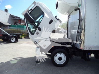 Truck cab and refrigerated box of a 2019 Hino 195 with side view showing cab tilt and front wheel.