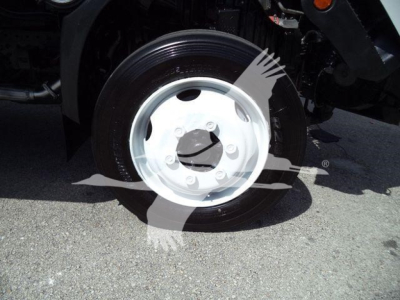 Hino 195 refrigerated truck wheel view showing steel wheel and tire in side angle.