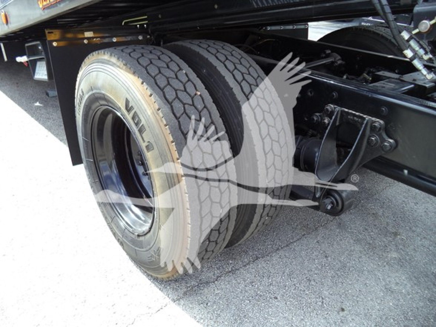 International Durastar 4300 rear dual rear tires and suspension seen on rollback truck.
