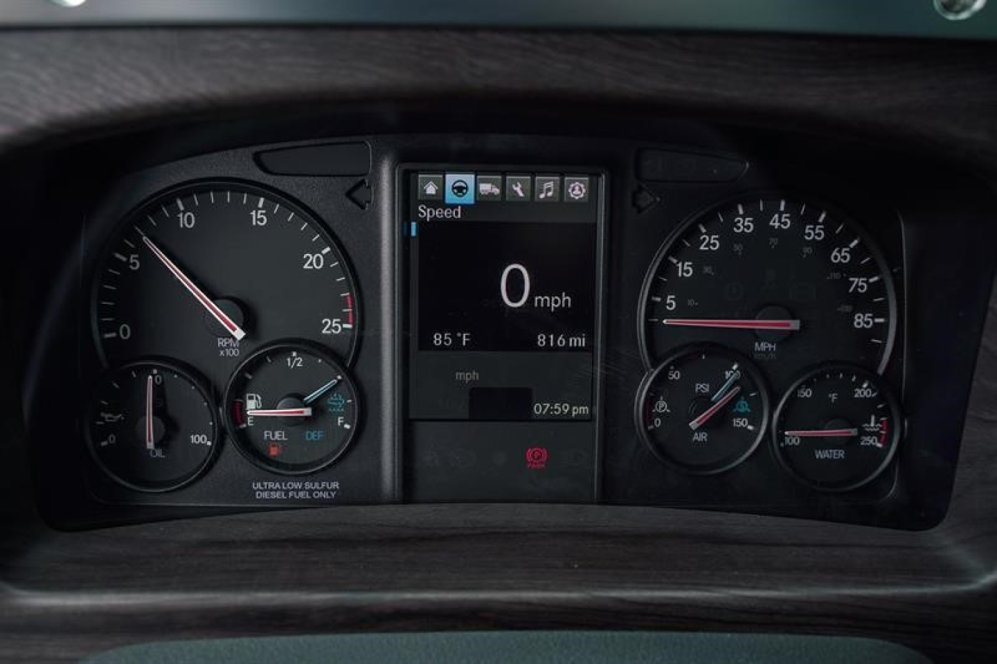 Dashboard view of a 2027 Western Star 47X showing speedometer, tachometer, center digital display at 0 mph, and various gauges.