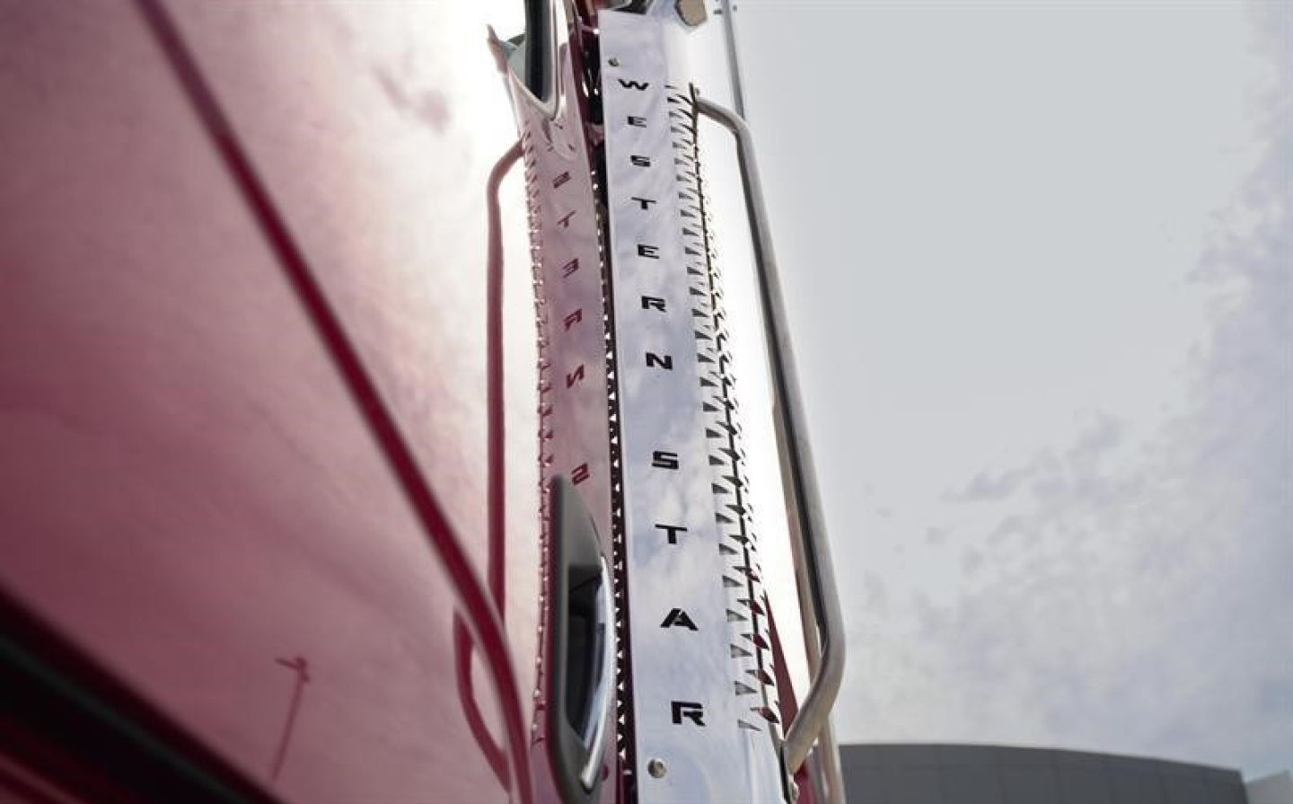 Vertical shot of Western Star truck cab panel with ruler-like measuring strip and fuel filler area visible.