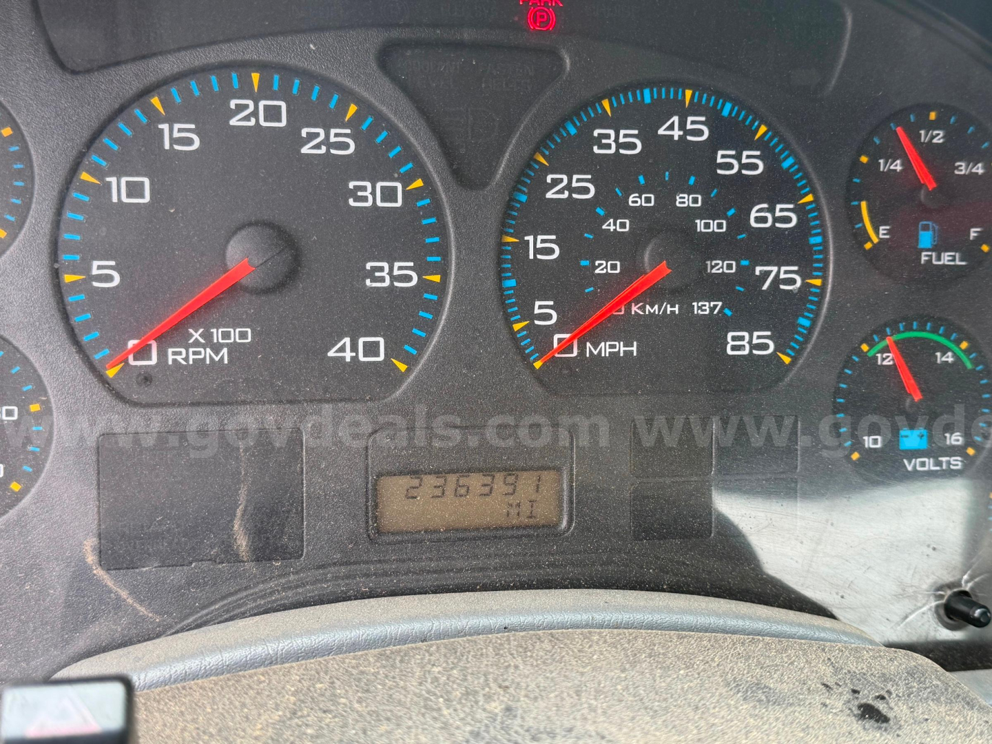 Dashboard view from a 2004 International 4300 showing tachometer 0-40 x100 RPM, speedometer 0-85 MPH, odometer 263691 miles, fuel gauge, and other gauges.
