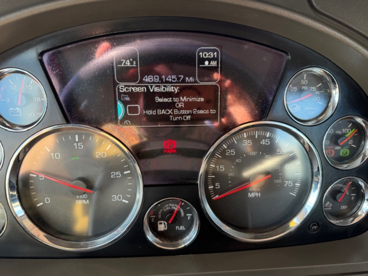Kenworth T880 dashboard view showing gauges including speedometer, tachometer, fuel, and digital display.