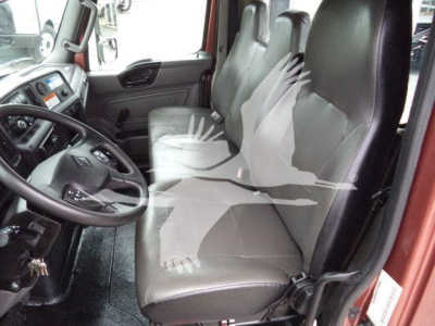 Interior of a 2020 International MV truck cab showing front seats and steering wheel.