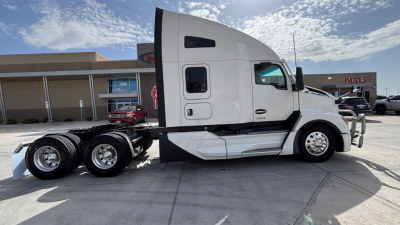 Kenworth T680 tractor side view showing third-wheel chassis and sleeper cab with windows and doors, front bumper, and dual rear axles.