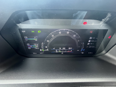 Dashboard view of a 2027 Mack AN64T truck showing digital gauges, gear indicator, and warning icons.