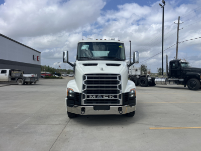 Front view of white 2027 Mack AN64T conventional daycab truck showing prominent grille and MACK badge.