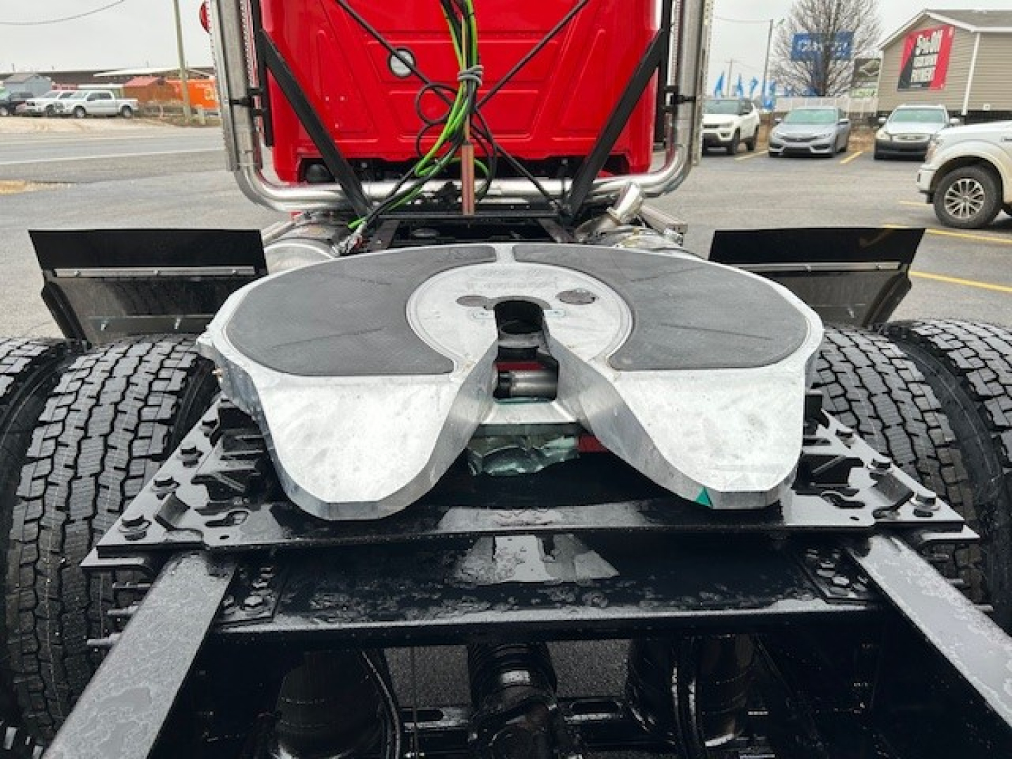 Mack PI64T engine bay area showing fifth wheel coupling and chassis with dual rear tires.