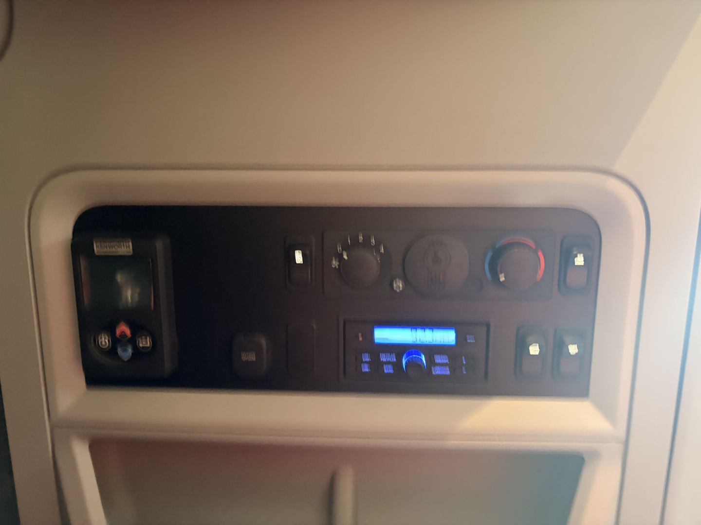 Kenworth T680 truck dash panel with controls and a digital display