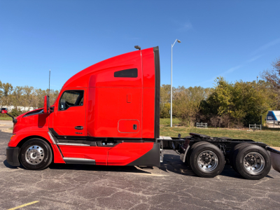 Kenworth T680 sleeper cab truck in red side view showing tractor chassis and rear wheels