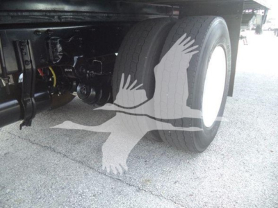 Freightliner M2 106 wheel and undercarriage view showing dual rear tires and suspension components.