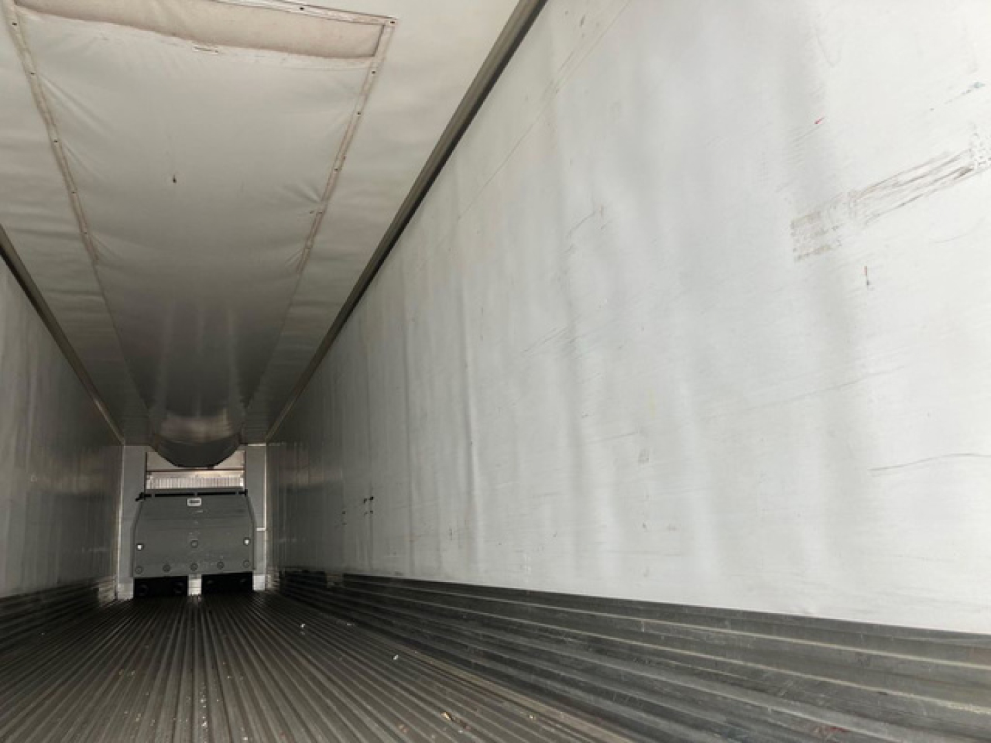Trailer interior of a 2022 Utility Reefer showing empty refrigerated cargo area with ribbed floor and white walls.