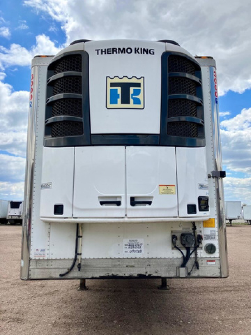Thermo King refrigerated trailer front view showing cooling unit and logo.