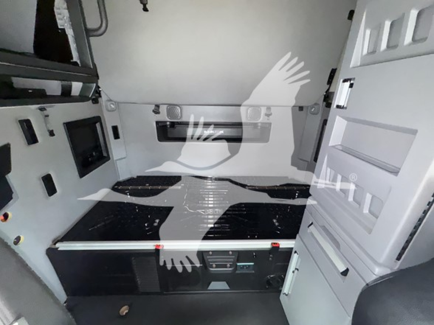 2019 Mack Anthem 64T sleeper cab interior showing storage drawer and wall panels.