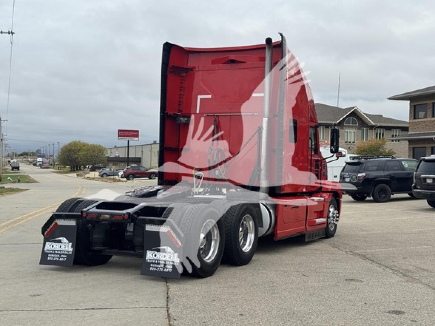 Semi truck tractor 2019 Mack Anthem 64T rear view showing dual rear axles and sleeper cab, red color, with fenders and mud flaps.