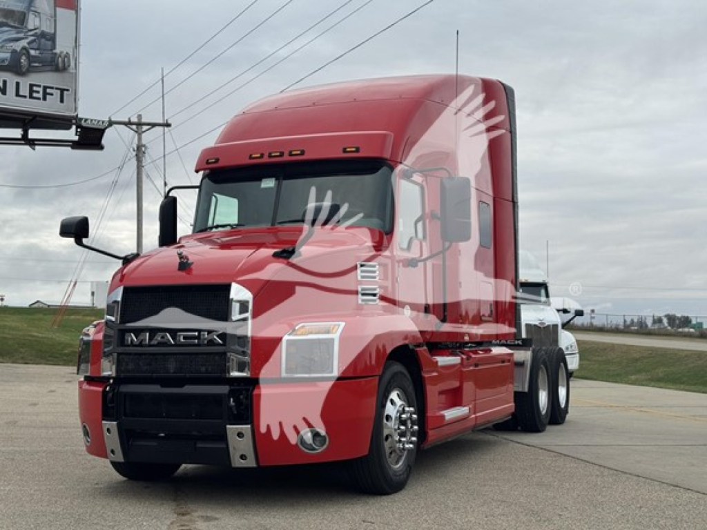 Truck: 2019 Mack Anthem 64T in red, daytime side view showing front grille and cab.