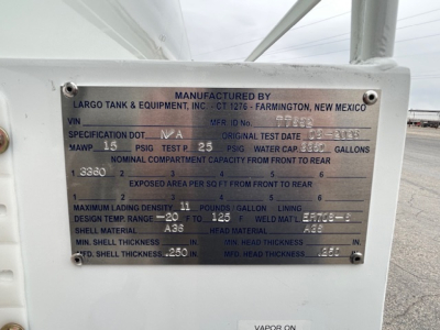 Metal data plate on Mack GR64B tank showing VIN 1M2GR4GC1TM055867, manufacturer Largo Tank & Equipment, specs include MAWP 15 PSIG, water cap 238? gallons, design temp range -20 to 125, shell material A36, head material A36.