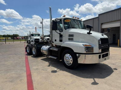 2020 Mack AN64T conventional daycab truck in a lot showing side view with sticker 2020 on windshield