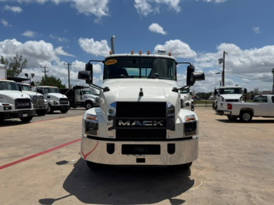 Front view of 2020 Mack AN64T conventional daycab truck in a dealership lot showing Mack grille and bumper; windshield with yellow inspection sticker