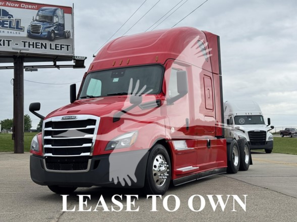 Freightliner Cascadia 126 sleeper truck in red parked outdoors with watermark text 'LEASE TO OWN' across front and side. Billboard in background.