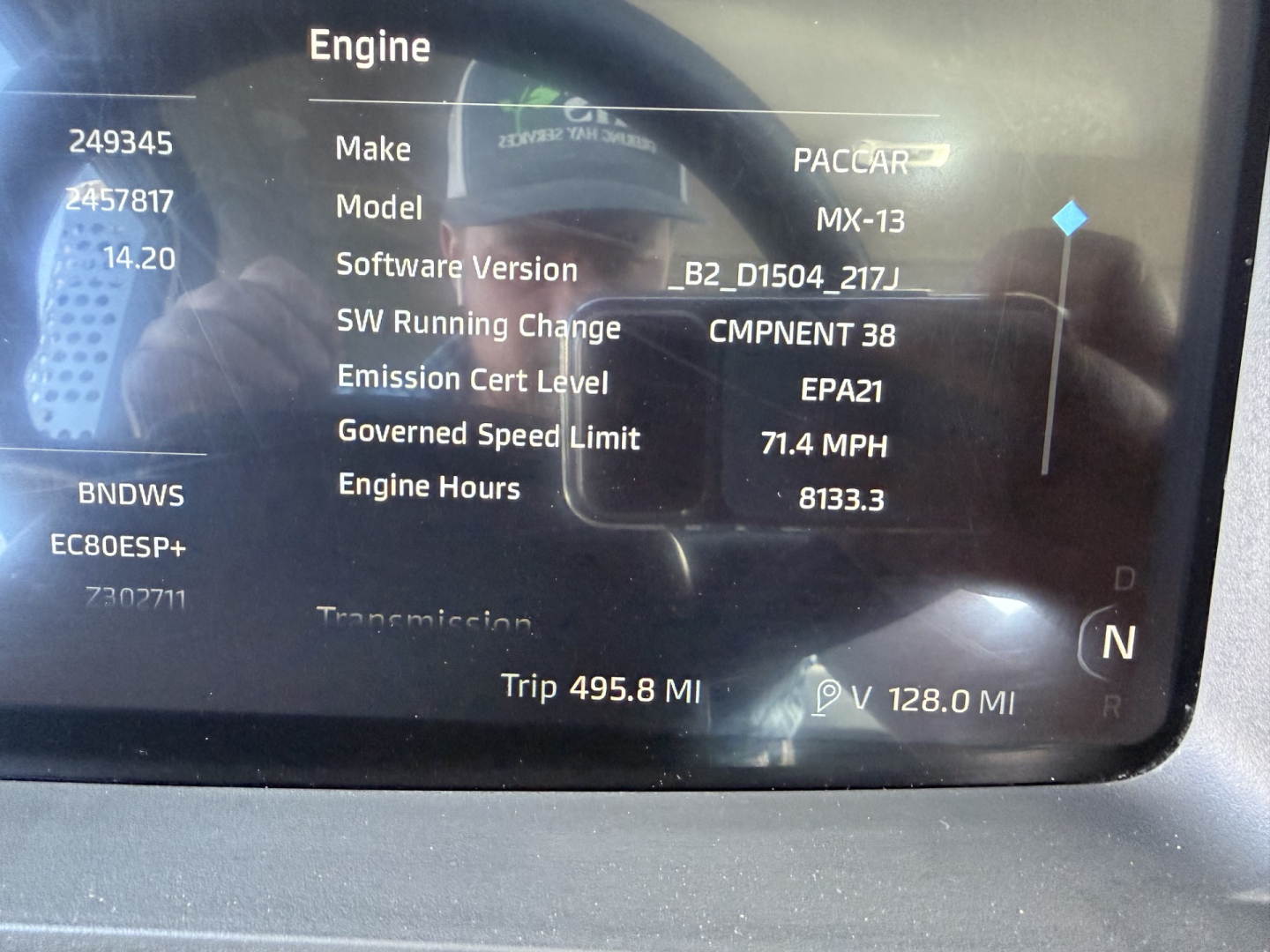 Engine display screen showing Make: PACCAR, Model: MX-13, Software Version B2_D1504_217J, Emission Cert Level EPA21, Governed Speed Limit 71.4 MPH, Engine Hours 8133.3, Trip 495.8 MI, V 128.0 MI, N gear indicator.