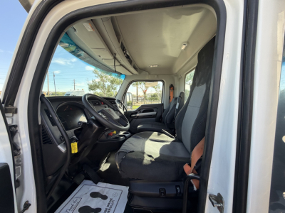 Kenworth T880 truck cab interior showing steering wheel, dashboard, and front seats.