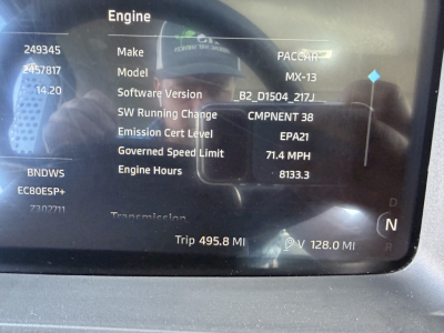 Engine display screen showing Make: PACCAR, Model: MX-13, Software Version B2_D1504_217J, Emission Cert Level EPA21, Governed Speed Limit 71.4 MPH, Engine Hours 8133.3, Trip 495.8 MI, V 128.0 MI, N gear indicator.
