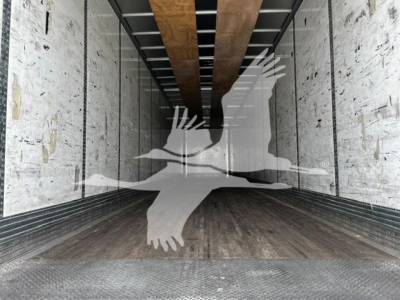 Trailer cargo space of a 2017 Wabash dry van trailer interior with wooden floor and aluminum walls.