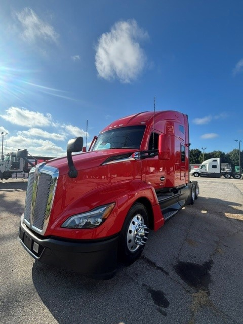 Kenworth T680 tractor-trailer in red, front-left view, with chrome grille and dual rearview mirrors.