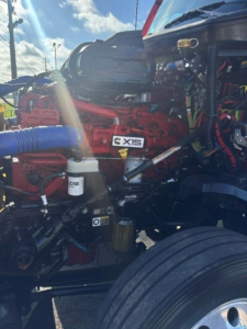 Kenworth T680 engine bay showing Cummins X15 label