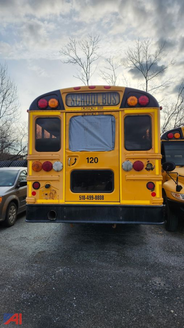 Rear view of a 2017 IC Corporation school bus showing yellow body, red and white lights, rear bumper, and bus number 120.