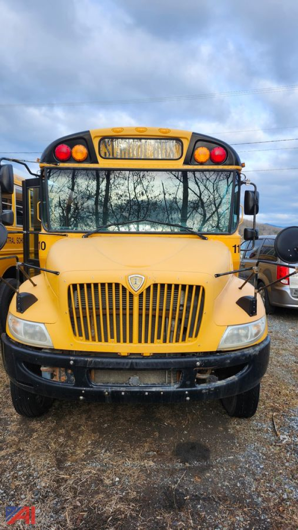 Front view of a yellow 2017 IC Corporation CE Series school bus showing grille, headlights, and windshield with school bus lights overhead.