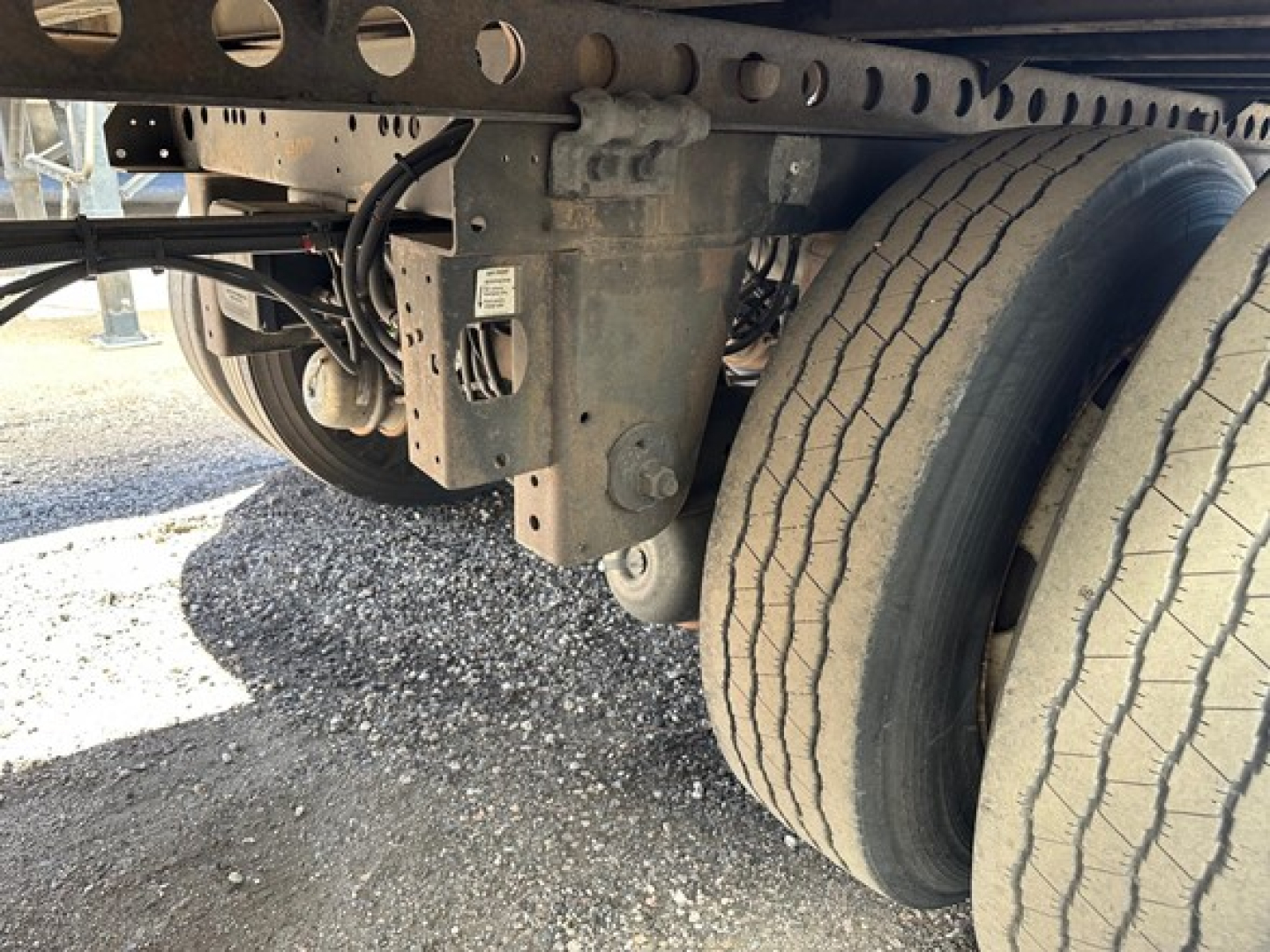 Hyundai air ride roll door dry van trailer undercarriage showing suspension components and dual wheels.