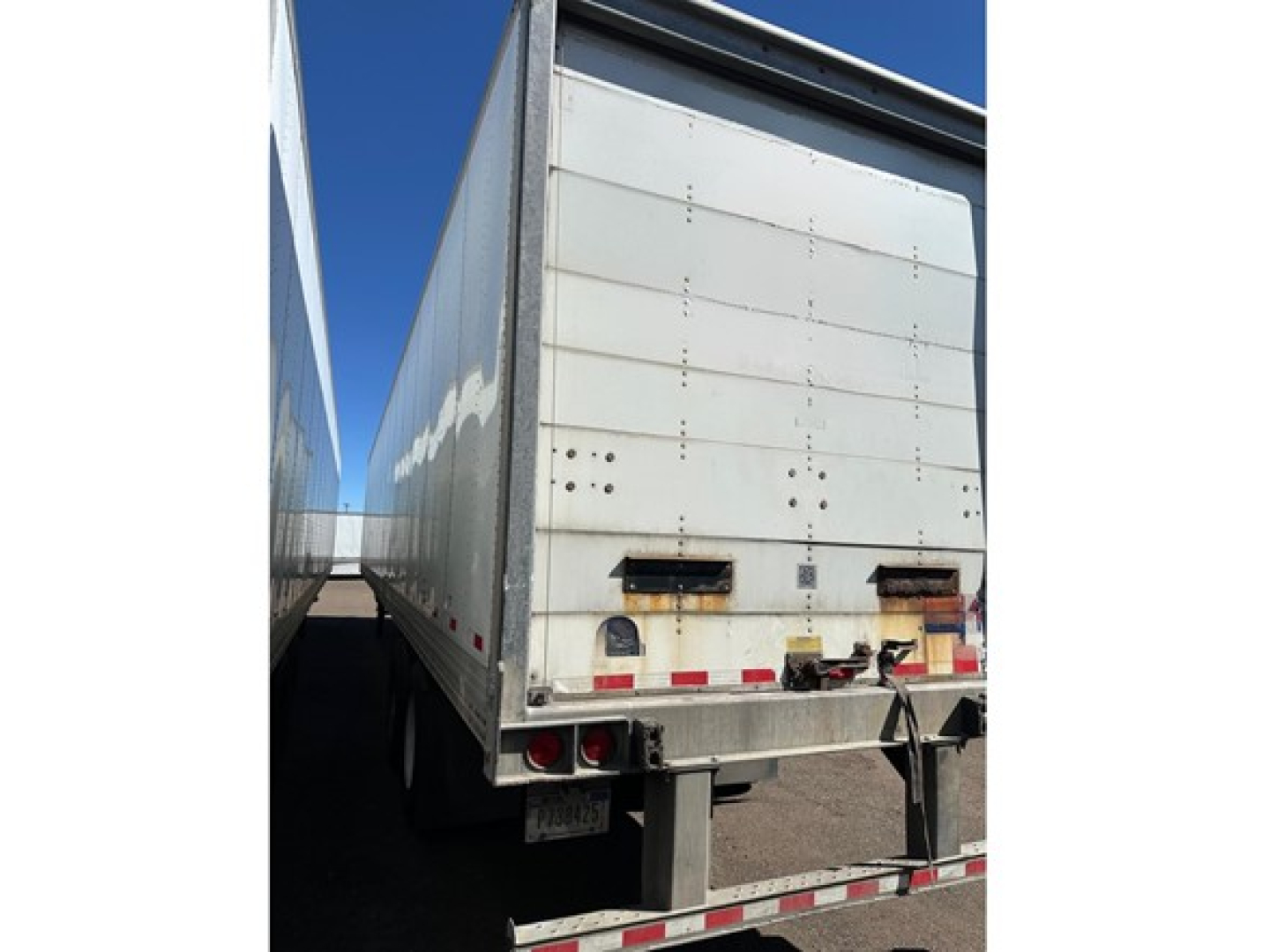 Rear view of a Hyundai air ride roll door dry van trailer showing back doors and bumper area.