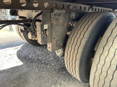 Trailer undercarriage showing dual rear tires and suspension components for a 2017 Hyundai air ride roll door dry van.