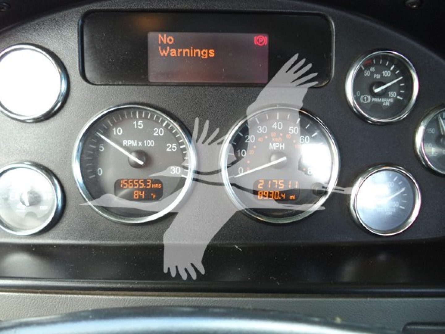 Peterbilt 348 instrument cluster showing RPM gauge, speedometer, digital displays, and No Warnings message.