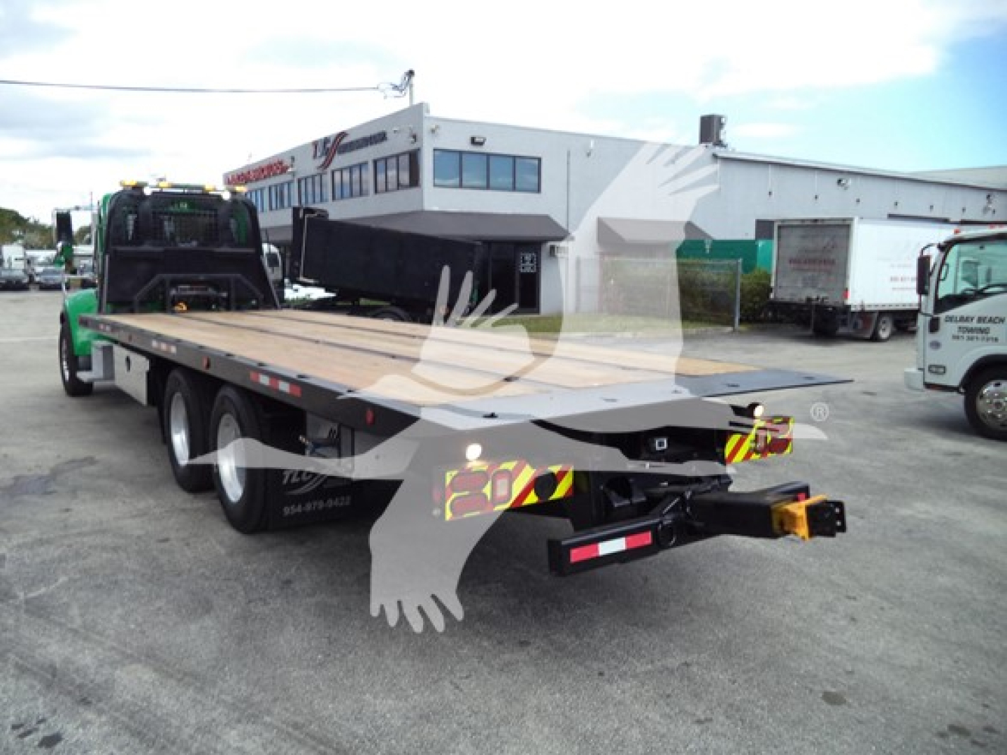 2016 Peterbilt 348 rollback truck with flatbed, rear view showing Ohio markings and equipment; visible text includes truck body and flatbed components.