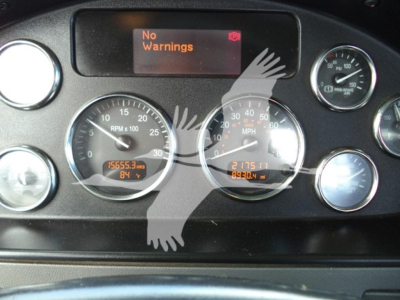 Peterbilt 348 instrument cluster showing RPM gauge, speedometer, digital displays, and No Warnings message.